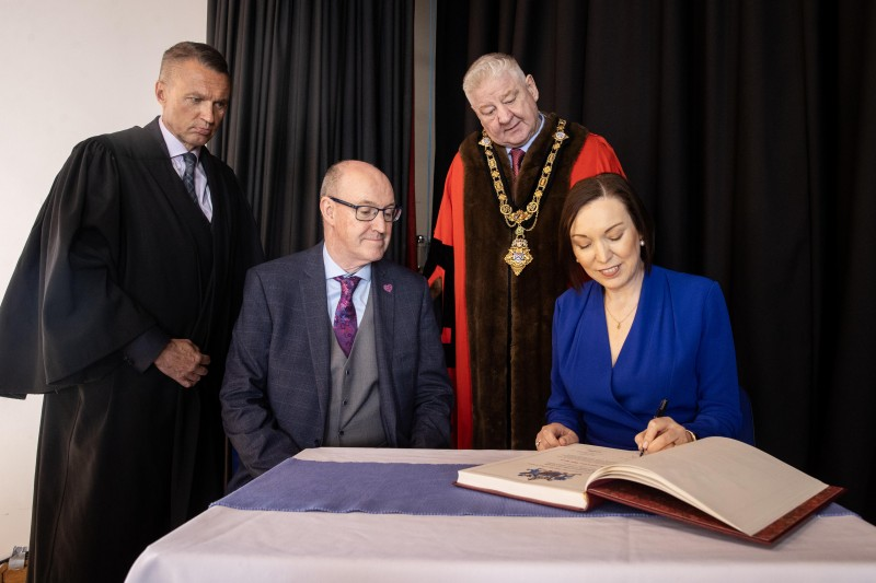 David Jackson, Chief Executive Causeway Coast and Glens Borough Council, Western Trust Chief Executive Neil Guckian OBE, Mayor of Causeway Coast and Glens Councillor Steven Callaghan QPM; as Jennifer Welsh, Chief Executive of the Northern Trust signs the Register of Honorary Burgesses.