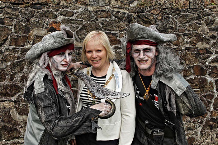 One of the most popular events of the year, â€˜Pirates Off Portrushâ€™, returned to the seaside resort of Portrush on Saturday 4th July. This time, the historical pirate, â€˜Tavish Dhuâ€™, faced one of his scariest foes yet â€“ his own ghost! Pictured is Mayor of Causeway Coast and Glens Borough Council, Councillor Michelle Knight-McQuillan with the Ghostly Pirates during the Pirates Off Portrush Festival. 