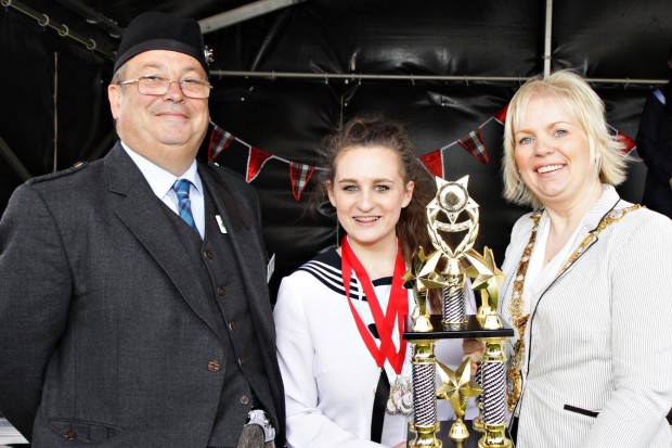 Pictured is Mayor of Causeway Coast and Glens Borough Council, Councillor Michelle Knight-McQuillan with Chairman of The Royal Scottish Pipe Band Association Northern Ireland, Ray Hall and prize winner at the competition which was part of the weekend of events during the North West Pipe Band Championships, Portrush.