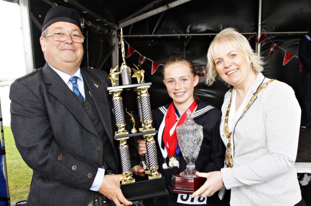 Pictured is Mayor of Causeway Coast and Glens Borough Council, Councillor Michelle Knight-McQuillan with Chairman of The Royal Scottish Pipe Band Association Northern Ireland, Ray Hall and prize winner at the competition which was part of the weekend of events during the North West Pipe Band Championships, Portrush. For further information please visit www.visitcausewaycoastandglens.com or call the Visitor Information Centre 028 7034 4723.