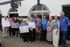 Deputy Mayor of Causeway Coast and Glens Borough Council, Alderman Sandra Hunter with Councillors Margaret Anne McKillop and Cara McShane, Stella Byrne, Head of Investment at The National Lottery Heritage Fund and volunteers from the Friends' of Ballycastle Museum.