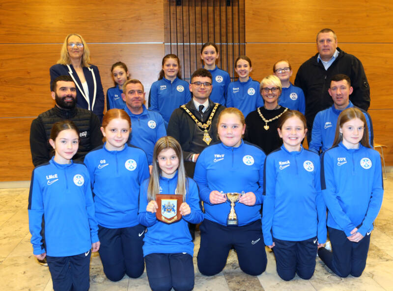 Causeway Coast and Glens Mayor Councillor Ciarán McQuillan and Deputy Mayor Councillor Tanya Stirling pictured with Mechelle Leeming and Alan McIntyre, Ballymoney United Youth Development Officers, and the Ballymoney Girls Youth Academy U13’s at a reception held to celebrate their recent success in local football.