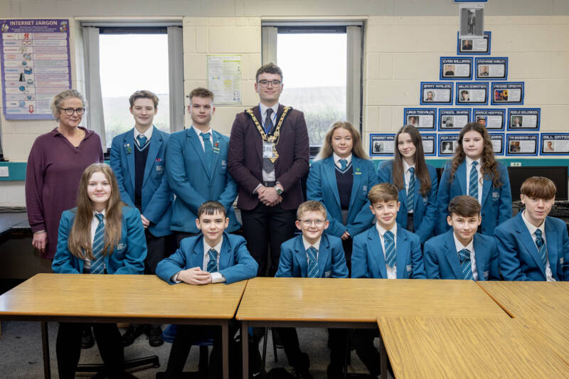 Mayor of Causeway Coast and Glens, Councillor Ciarán McQuillan pictured with North Coast Integrated College Principal Angela Passmore and Key Stage 4 students at ‘Breaktime with the Mayor’ part of the ‘Pupil Voice’ series held in the school.