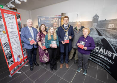 Mayor of Causeway Coast and Glens, Councillor Ciarán McQuillan pictured at the opening of the Holocaust Memorial exhibition in Roe Valley Arts & Cultural Centre. Included in the photo are Councillor Steven Callaghan, author of the Canada booklet, Joy Wisener, Good Relations Officer and Jamie Austin, Museum Officer alongside Hester McCunn, Robert Guthrie and Robert Peacocke from Binevenagh Historical Society.