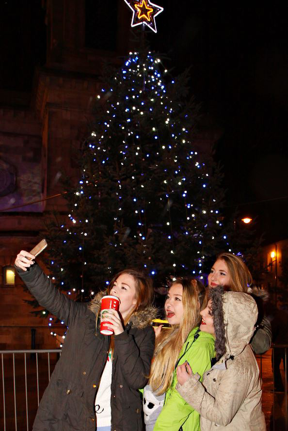 Roisin, Weronkia, Kaja and Natalia take a 'selfie' with Coleraine's Christmas Tree at the Christmas Light Switch On, Friday 27th of November.