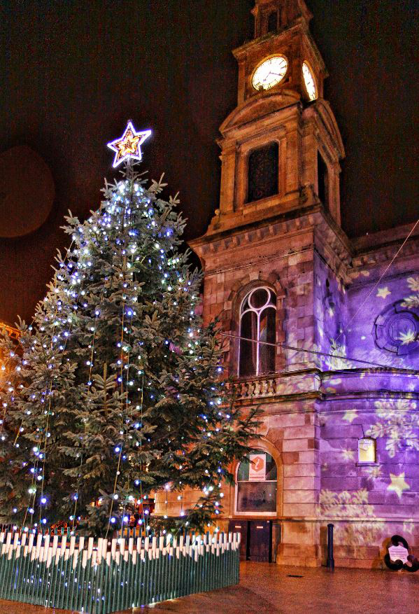 Coleraine's Christmas Tree and Christmas Light projection on the walls of Coleraine Town Hall.