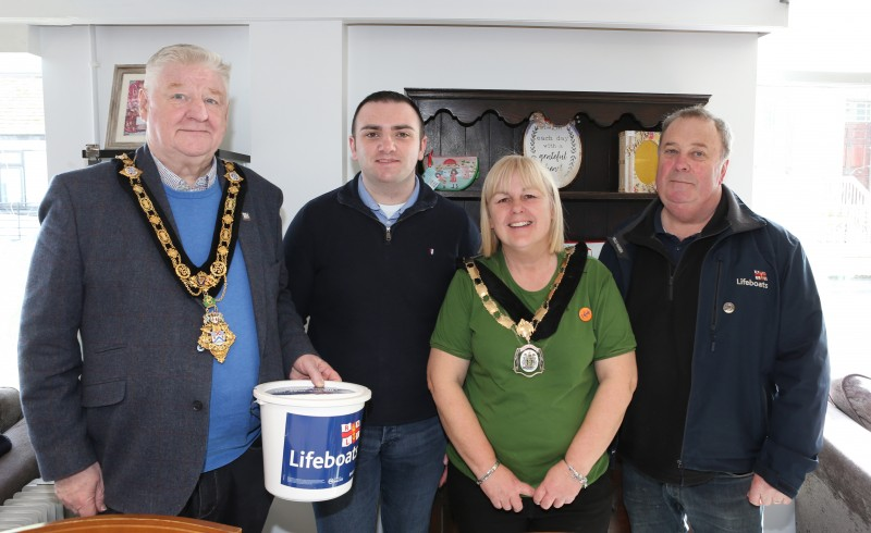 Mayor of Causeway Coast and Glens, Councillor Steven Callaghan, pictured with Deputy Mayor, Councillor Margaret-Anne McKillop pictured alongside two members of the RNLI at a coffee morning fundraiser.