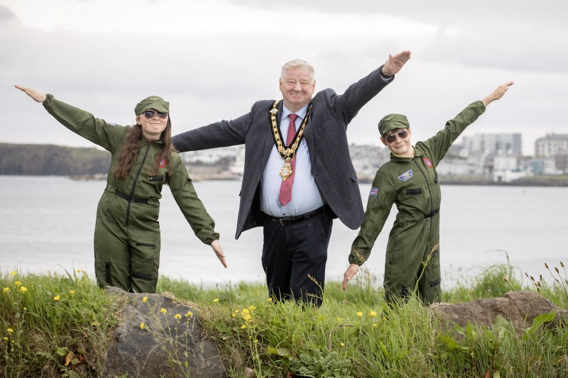 - The Mayor, Cllr Stephen Callaghan, pictured alongside Portrush Primary School pupils Leah and Alfie, making aeroplane gestures