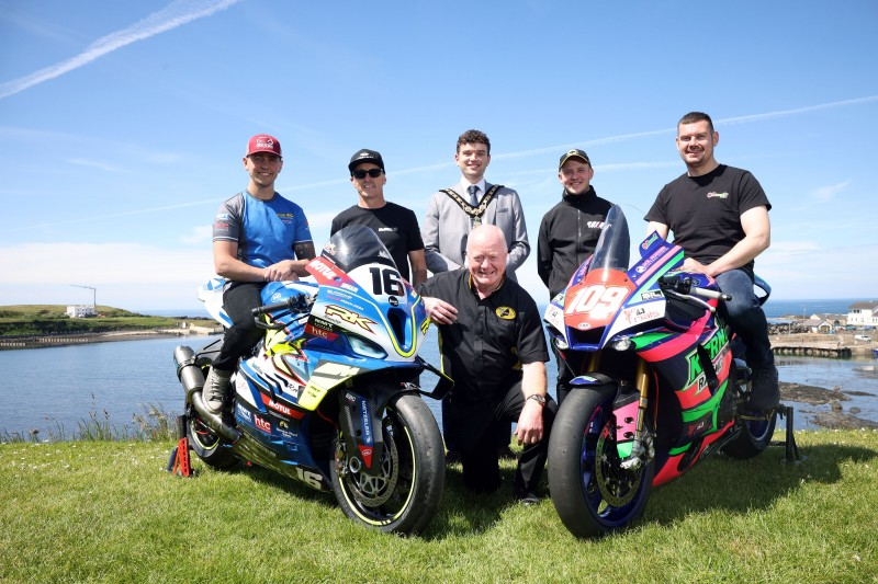 Chairman of Armoy Motorcycle Road Racing Club and Clerk of Course William Munnis, with the Mayor of Causeway Coast and Glens, Councillor Ciarán McQuillan, pictured with road racers Dominic Herbertson, Jeremy McWilliams, Ryan Whitehall and Neil Kernohan.
