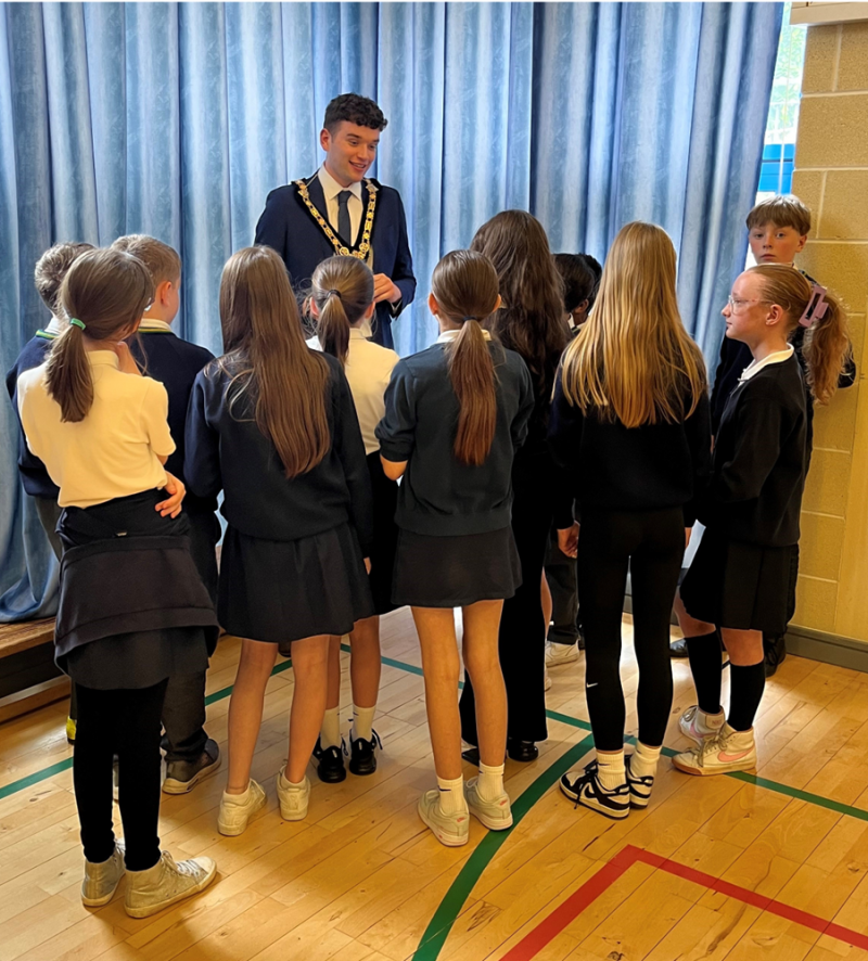 The Mayor of Causeway Coast and Glens, Councillor Ciarán McQuillan chats to pupils from St Patrick’s and St Brigid’s Primary School, who were involved in the recently unveiled ‘Young Historians’ project.