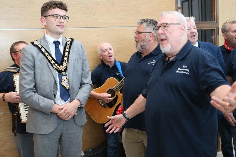 The Causeway Shantymen entertaining the Mayor of Causeway Coast and Glens, Councillor Ciarán McQuillan, with their interpretations of traditional sea shanties.