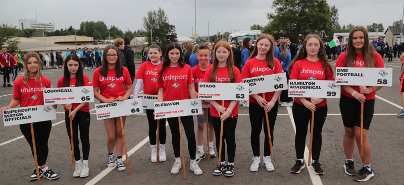 A group of children pictured with team signs ahead of the SuperCupNI Welcoming Parade and Opening Ceremony.