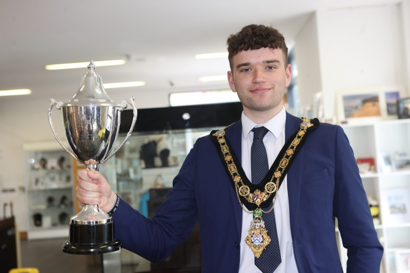 Mayor of Causeway Coast and Glens Councillor Ciarán McQuillan at the unveiling of a new football themed display in Roe Valley Arts and Cultural Centre, which features the 2023 SuperCupNI, Premier Winners trophy won by the County Londonderry team and associated memorabilia.