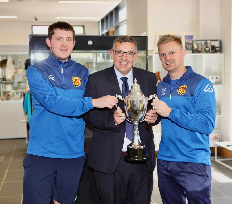 Pictured at the unveiling of a new football themed display in Roe Valley Arts and Cultural Centre are Thomas Reid, David Reid and David Miller.