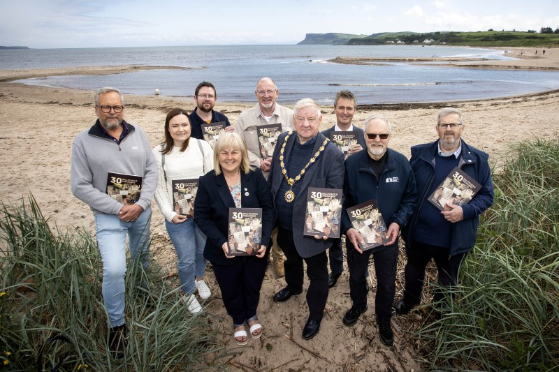 Pictured at the launch of the 30 Ballycastle Treasures book at Rathlin Sound Festival are the then Mayor of the Causeway Coast and Glens, Councillor Steven Callaghan, the then Deputy Mayor of Causeway Coast and Glens, Councillor Margaret-Anne McKillop, Council staff, contributors, members of the Friends of Ballycastle Museum, and Colin Slack from Colin Slack Graphic & Web Design.