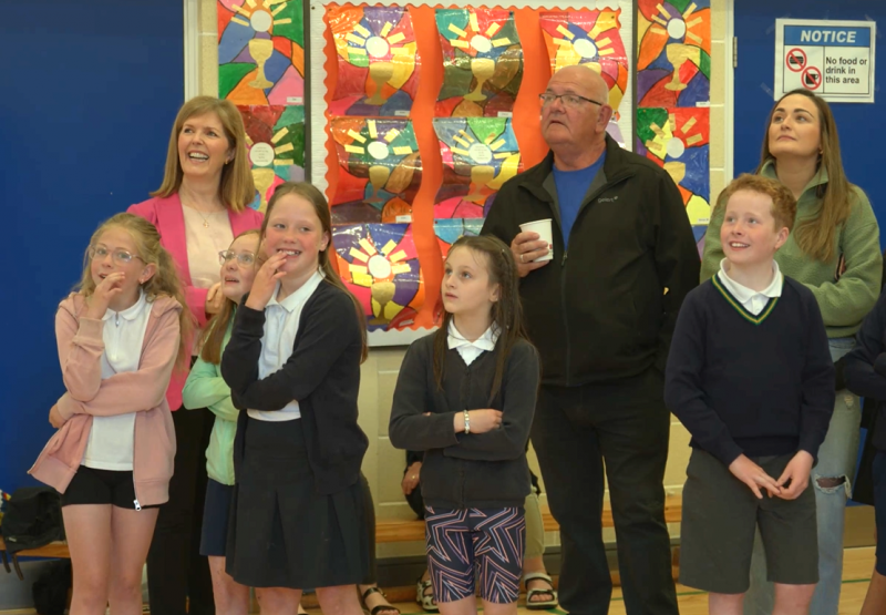 Pictured at the unveiling of the ‘Young Historians’ project School, are the children and parents who attended the event; the children recorded historical ‘stories’ and presented these in various creative ways.