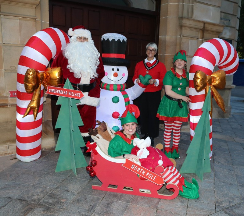 Causeway Coast and Glens Deputy Mayor, Councillor Tanya Stirling, pictured with Santa and his elves at the launch of the Christmas Light Switch On events in the Borough.