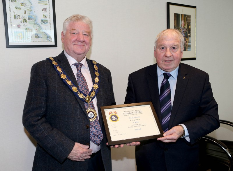 The Mayor of Causeway Coast and Glens, Councillor Steven Callaghan, with Dessie Stewart and his certificate.