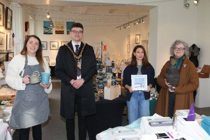 Local makers Fiona Shannon (Fiona Shannon Ceramics), and Patricia Millar (Patricia Millar Ceramics), pictured with Catriona Brogan, Flowerfield Customer Service Agent, welcoming Mayor of Causeway Coast and Glens, Councillor Ciarán McQuillan to the Christmas Craft Market in Flowerfield Arts Centre.