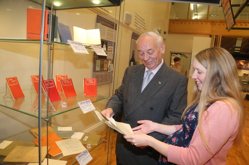 Mac Pollock from Ballymoney Drama Festival pictured looking at an original script belonging to George Shiels with Jamie Austin, Museum Officer, Causeway Coast and Glens Borough Council.