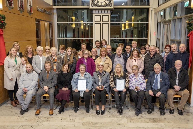 Members of Moneydig Rural Network who were invited to a reception to celebrate Moneydig Park winning two NIAC ‘Best Kept Awards’. The group are pictured with Deputy Mayor of Causeway Coast and Glens, Councillor Tanya Stirling and Mark Alexander, Housing Executive Area Manager.