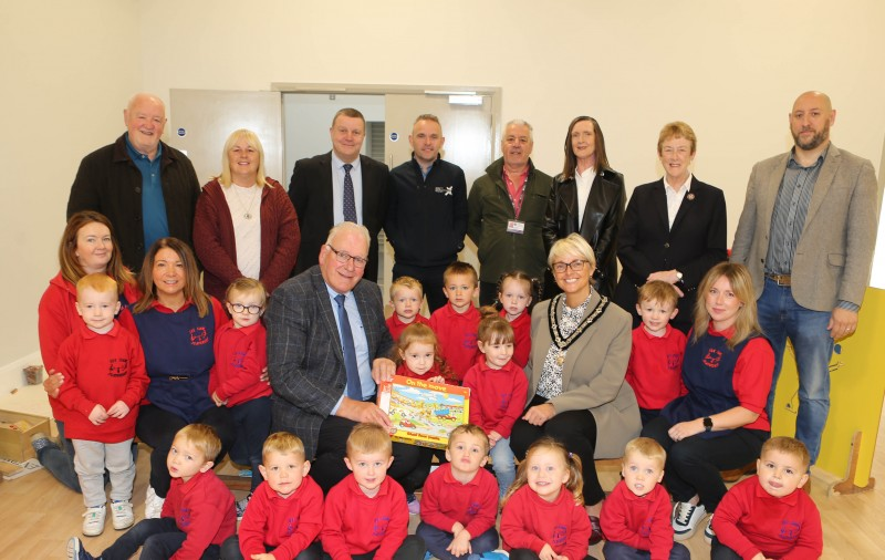 Causeway Coast and Glens Deputy Mayor, Councillor Tanya Stirling, pictured with children and staff from See-Saw Playgroup, Mosside at the re-opening of the Mosside Community Centre, after the completion of recent refurbishment works to its main hall. They are pictured alongside (l-r) Bob Hedley, Councillor Margaret-Anne McKillop, Ian McQuitty, Department for Communities, Niall McGurk, CC&G Strategic Project Manager, Nigel McFadden, CC&G Project Coordinator, Rhonda Williamson, Department for Communities, Joan Baird, Reverend Dr. Andre Alvez-Areias and Councillor Bill Kennedy.