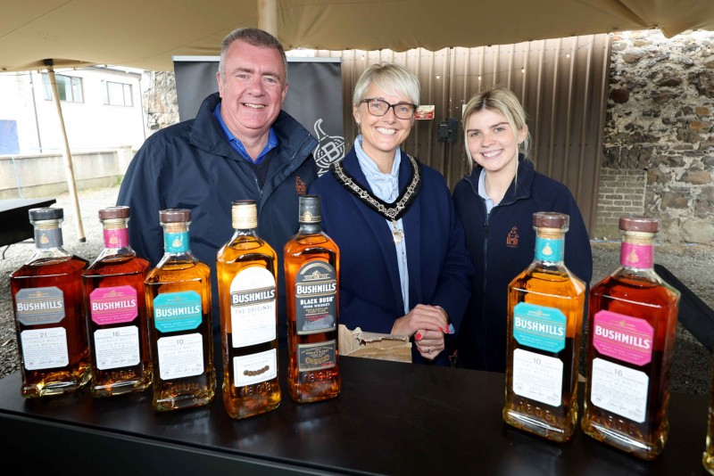 Deputy Mayor of Causeway Coast and Glens Councillor Tanya Stirling pictured with the team from The Old Bushmills Distillery, part of the Whiskey Hub at the 2024 Salmon and Whiskey Festival in Bushmills.