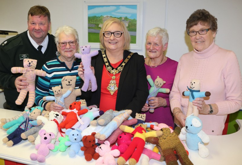 The Mayor of Causeway Coast and Glens Borough Council, Councillor Brenda Chivers pictured with Una Hardy, Deirdre Cauley and Olive Mc Carron from Nimble Needles Knitting Group and Sergeant Terry McKenna with a selection of the trauma teddies designed to bring comfort to children in distress.