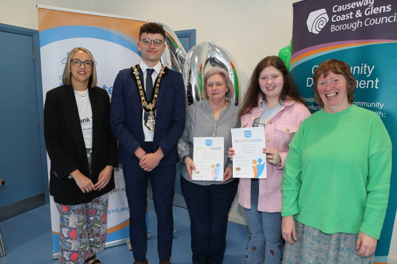 Mayor of Causeway Coast & Glens Borough Council, Councillor Ciarán McQuillan pictured at a Mayoral reception in Magilligan alongside Council staff and volunteers Angela Linton (200 hours EPIC Award) and Abigail Linton (50 hours EPIC Award).