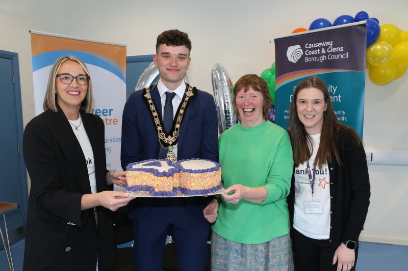 Mayor of Causeway Coast & Glens Borough Council, Councillor Ciarán McQuillan pictured at a Mayoral reception in Magilligan alongside Council staff and volunteers.