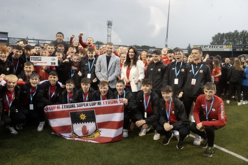 The County Tyrone team pictured with Deputy First Minister Emma Little-Pengelly and special guest Stuart Dallas at the SuperCupNI Opening Ceremony in Coleraine Showgrounds.