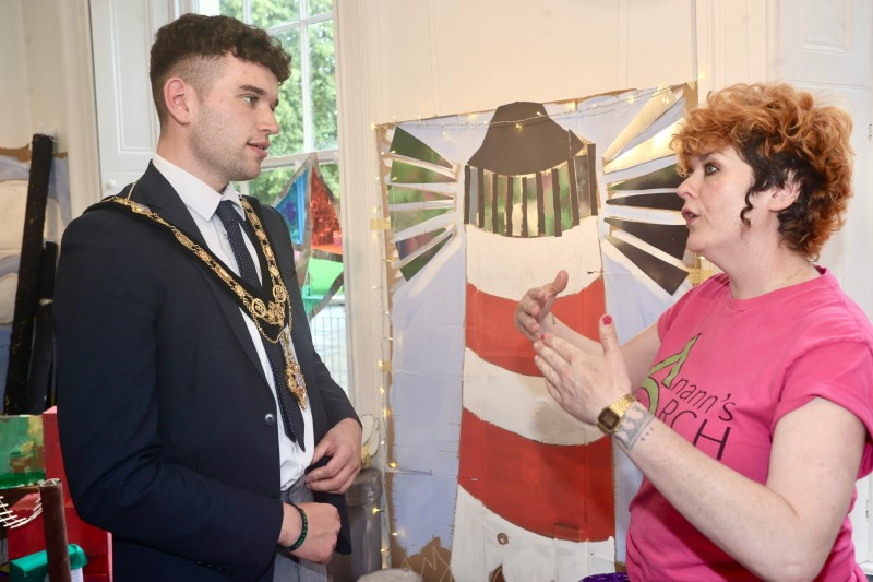Mayor of Causeway Coast and Glens Councillor Ciarán McQuillan pictured with workshop facilitator Elaine Taylor of Anann's Arch at the launch of the “Cardboard Coast Town” exhibition in Flowerfield Arts Centre.