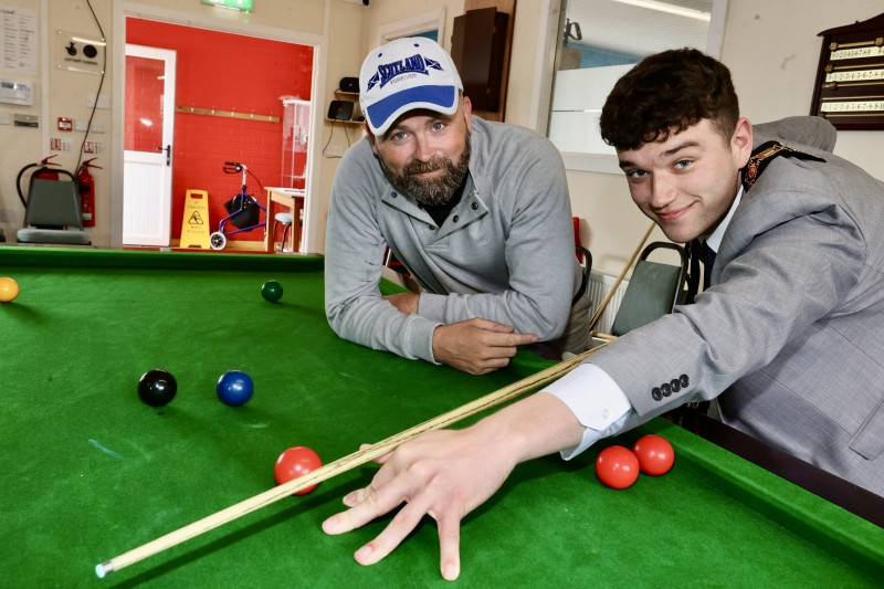 The Mayor of Causeway Coast and Glens, Councillor Ciarán McQuillan, alongside one of the Men’s Shed members Craig, enjoying a game of snooker.