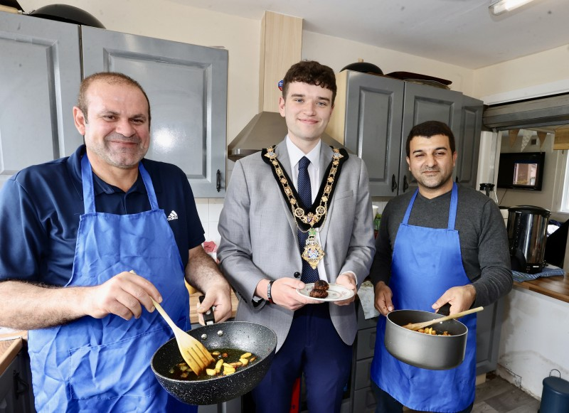 The Mayor, Cllr Ciarán McQuillan, alongside Ali and Babi from the Men’s Shed