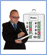 A person in a suit writing on a clipboard which has the title risks