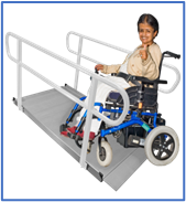 A person in a wheelchair using an entry ramp